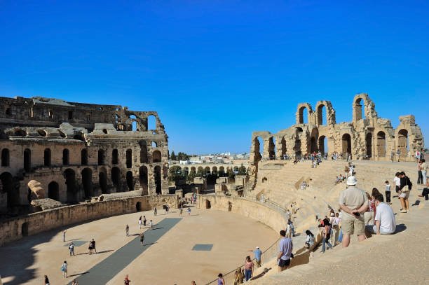 El Djem, Mahdia, Tunisia - September 28, .2004: Tourists visit Ancient Roman amphitheater in El Jem in Tunisia