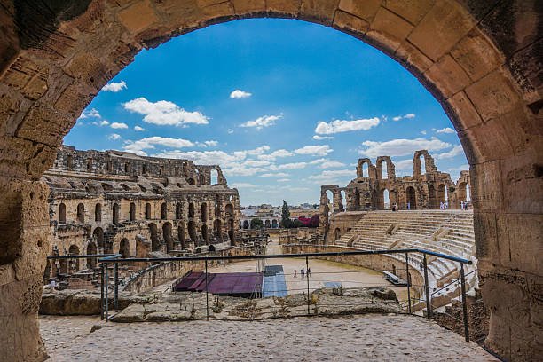 The El Jem Amphitheatre in Tunisia is a majestic Roman monument and one of the best-preserved ancient ruins in North Africa. This grand Roman arena, built during the height of the Roman Empire, showcases impressive architecture with massive arches and sturdy stone structures. As a UNESCO heritage and archaeological site, it served as a venue for gladiators and public spectacles. Today, it remains a famous historic landmark and a popular travel destination for those fascinated by Roman history, ancient wonders, and imperial engineering. The El Jem colosseum stands as a testament to the rich culture and legacy of ancient civilization in the Mediterranean region.